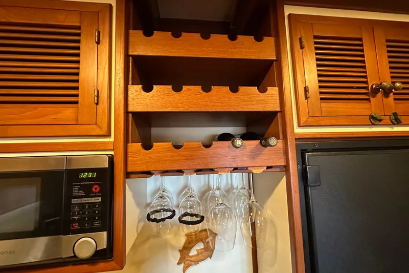 Slide: The Image of Wooden wine rack and glass holder in 1987 Kadey-Krogen Manatee 36 kitchen. - 40