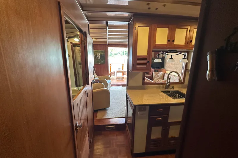 Slide: The Image of Interior of 1987 Kadey-Krogen Manatee 36 yacht, featuring cozy living area and kitchen. - 42