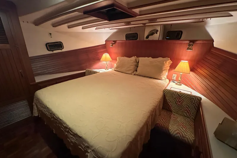 Slide: The Image of Luxurious 1987 Kadey-Krogen Manatee 36 cabin with cozy bed and warm lighting. - 47