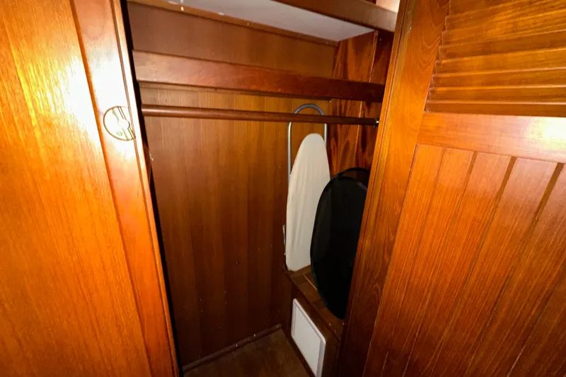 Slide: The Image of Wooden closet interior on 1987 Kadey-Krogen Manatee 36 boat, featuring storage space. - 52