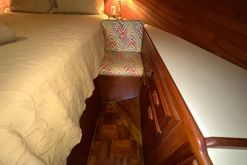 Slide: The Image of Cozy cabin interior of 1987 Kadey-Krogen Manatee 36 with wooden furniture and patterned upholstery. - 55