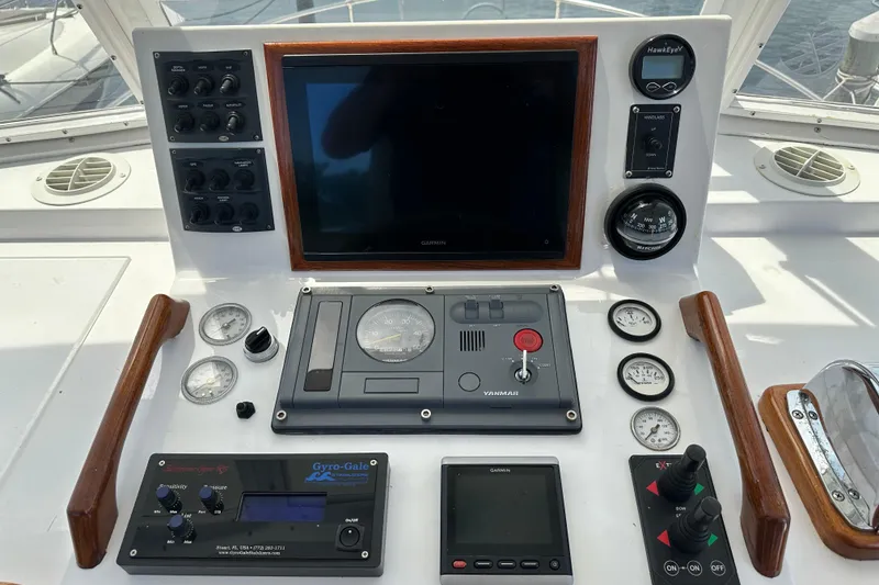 Slide: The Image of Control panel of a 1987 Kadey-Krogen Manatee 36 boat with navigation instruments. - 57
