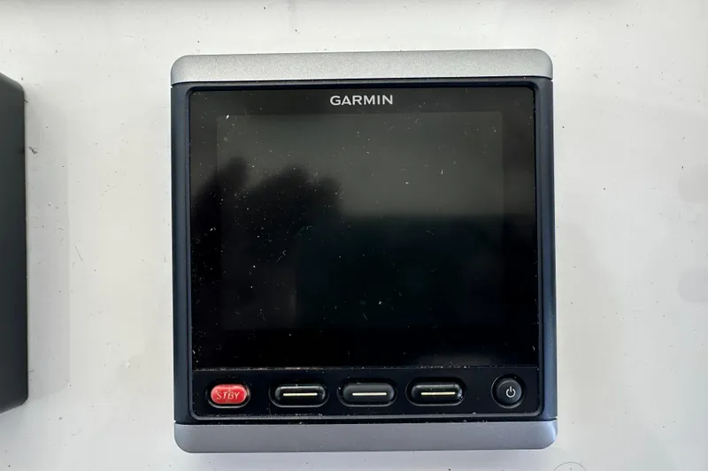 Slide: The Image of Garmin marine device on 1987 Kadey-Krogen Manatee 36 yacht dashboard. - 59