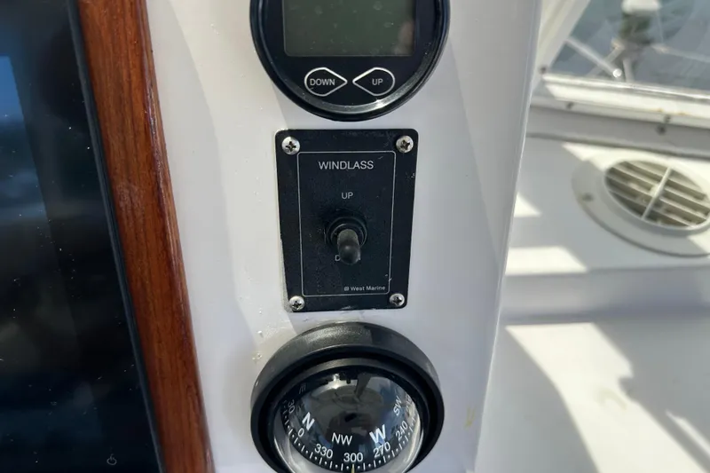 Slide: The Image of Control panel on a 1987 Kadey-Krogen Manatee 36 boat, featuring windlass and compass. - 63