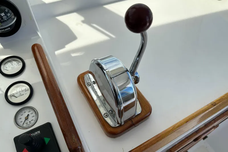 Slide: The Image of Throttle control and gauges on a 1987 Kadey-Krogen Manatee 36 boat dashboard. - 64