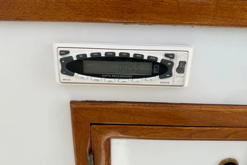 Slide: The Image of Digital media receiver on 1987 Kadey-Krogen Manatee 36 boat, surrounded by wood trim. - 66