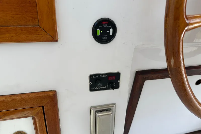 Slide: The Image of Control panel of a 1987 Kadey-Krogen Manatee 36 boat with bilge pump switch. - 67