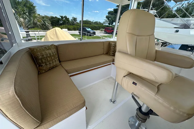 Slide: The Image of Interior of 1987 Kadey-Krogen Manatee 36 with beige seating and helm chair. - 74