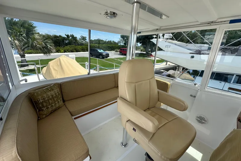 Slide: The Image of Interior of 1987 Kadey-Krogen Manatee 36 yacht with beige seating and helm chair. - 78