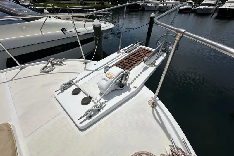 Slide: The Image of Bow of 1987 Kadey-Krogen Manatee 36 yacht with anchor and railing in marina. - 83