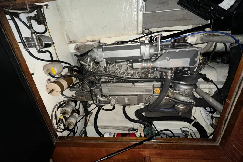 Slide: The Image of Engine compartment of a 1987 Kadey-Krogen Manatee 36 boat, showcasing mechanical components. - 89