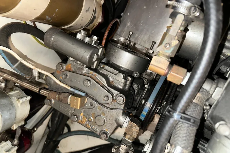 Slide: The Image of Engine components of a 1987 Kadey-Krogen Manatee 36 boat, showcasing mechanical details. - 94