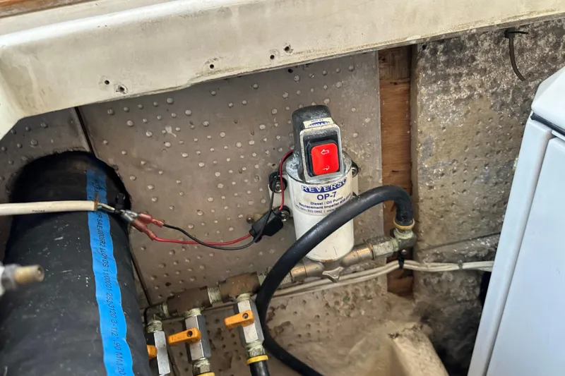 Slide: The Image of 1987 Kadey-Krogen Manatee 36 engine compartment with Reverso OP-7 diesel oil pump. - 98