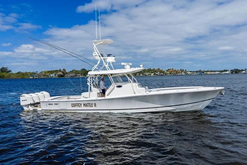The Image of 2018 Regulator 41 boat on water, clear sky, side view. - 0