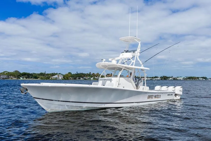 Slide: The Image of 2018 Regulator 41 boat on water under blue sky with clouds. - 10