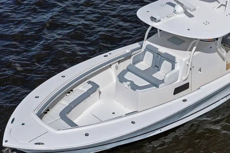 Slide: The Image of 2018 Regulator 41 boat with sleek white design and spacious seating on water. - 12