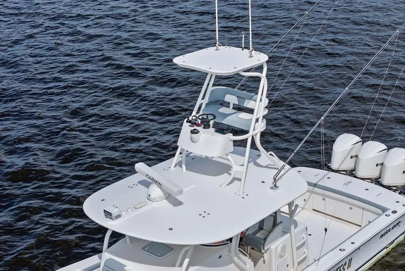 Slide: The Image of 2018 Regulator 41 boat with tower and multiple outboard engines on water. - 13