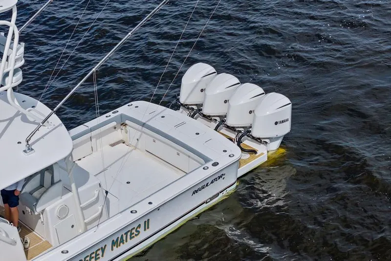 Slide: The Image of 2018 Regulator 41 boat with four Yamaha outboard engines on water. - 14