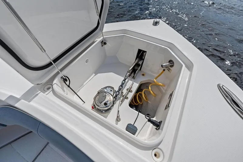 Slide: The Image of Open anchor locker on 2018 Regulator 41 boat, featuring anchor chain and hose. - 18