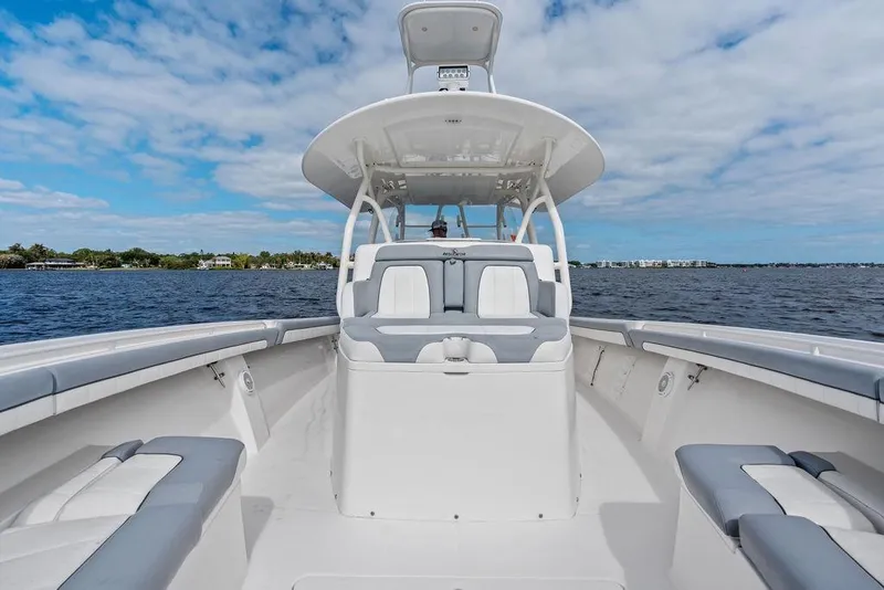 Slide: The Image of 2018 Regulator 41 boat on open water under a partly cloudy sky. - 21