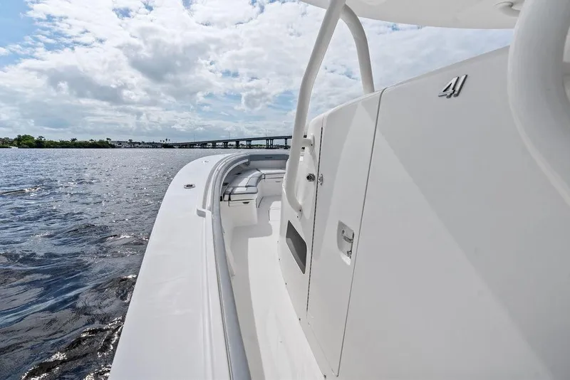 Slide: The Image of 2018 Regulator 41 boat on water, showcasing sleek design and spacious deck. - 22