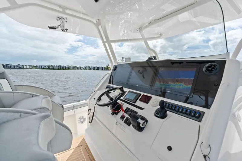 Slide: The Image of Cockpit view of 2018 Regulator 41 boat with advanced navigation system. - 27