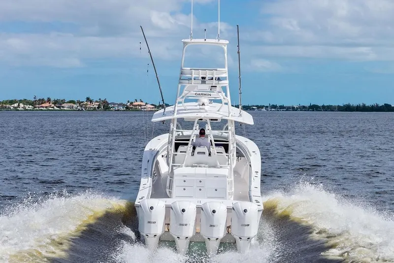 Slide: The Image of 2018 Regulator 41 boat cruising on open water with powerful engines. - 3