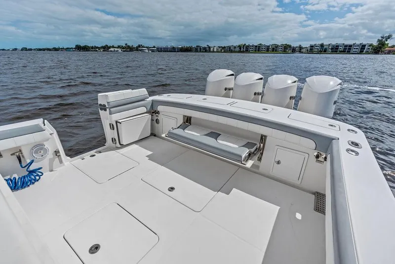 Slide: The Image of 2018 Regulator 41 boat with spacious deck and four powerful engines on a calm lake. - 30