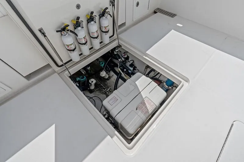Slide: The Image of Open engine compartment of 2018 Regulator 41 boat with fire extinguishers visible. - 34