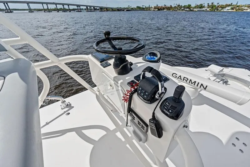 Slide: The Image of Helm of 2018 Regulator 41 boat with Garmin navigation system on open water. - 37