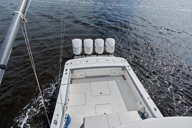 Slide: The Image of 2018 Regulator 41 boat with four engines on open water. - 39