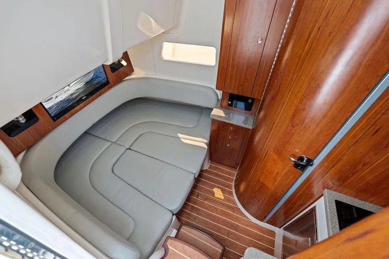 Slide: The Image of Luxurious interior of 2018 Regulator 41 boat with wood accents and plush seating. - 40