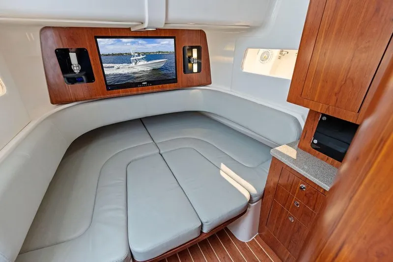Slide: The Image of Luxurious interior of 2018 Regulator 41 boat with seating and TV. - 42
