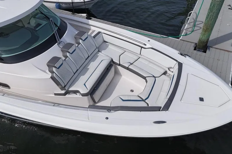 Slide: The Image of 2021 Tiara Sport 43 LS boat with spacious seating at the dock. - 11