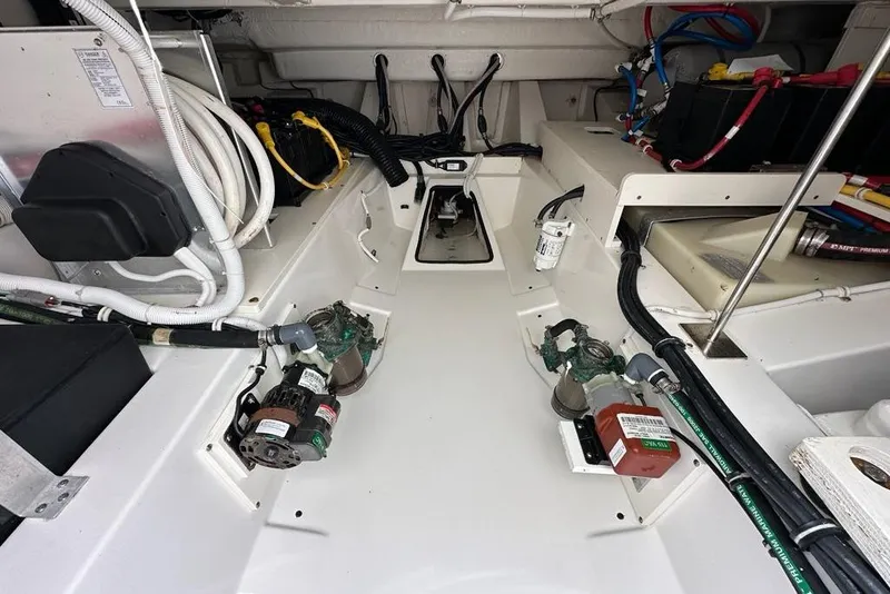 Slide: The Image of Engine compartment of a 2021 Tiara Sport 43 LS boat, showcasing wiring and components. - 16