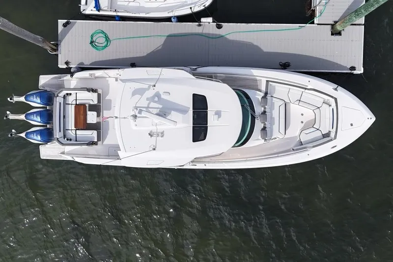 Slide: The Image of Aerial view of 2021 Tiara Sport 43 LS yacht docked at a marina. - 4