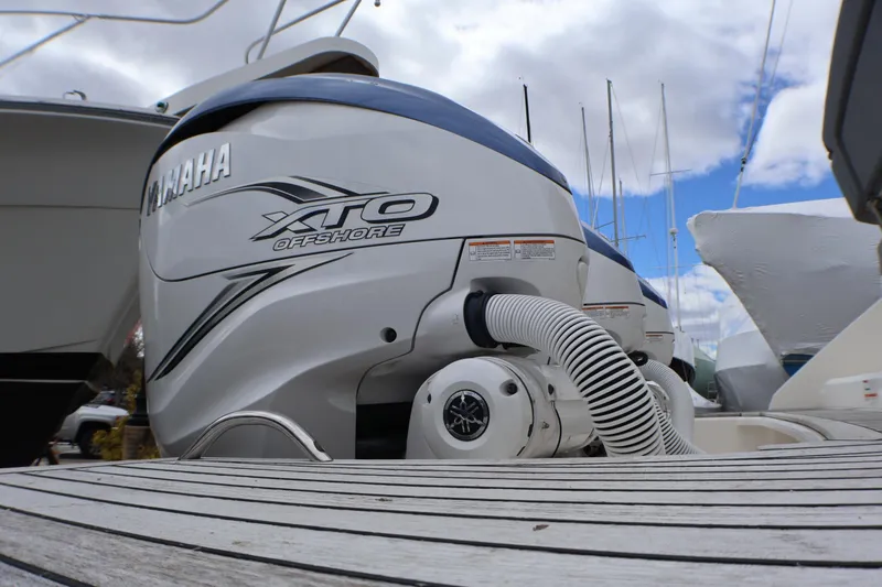 Slide: The Image of Yamaha XTO Offshore engine on 2021 Tiara Sport 43 LS boat, docked under cloudy sky. - 46