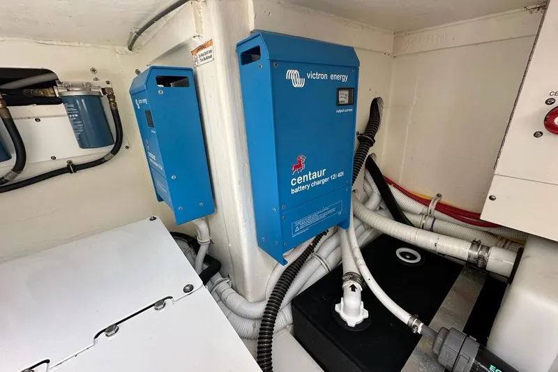 Slide: The Image of Battery chargers in 2021 Tiara Sport 43 LS boat engine room. - 61