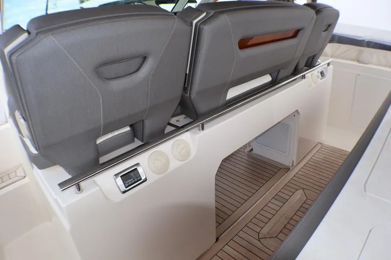 Slide: The Image of 2021 Tiara Sport 43 LS boat interior with sleek seating and modern design features. - 81