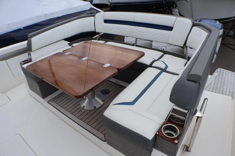 Slide: The Image of Luxurious seating area on 2021 Tiara Sport 43 LS yacht with elegant wooden table. - 85
