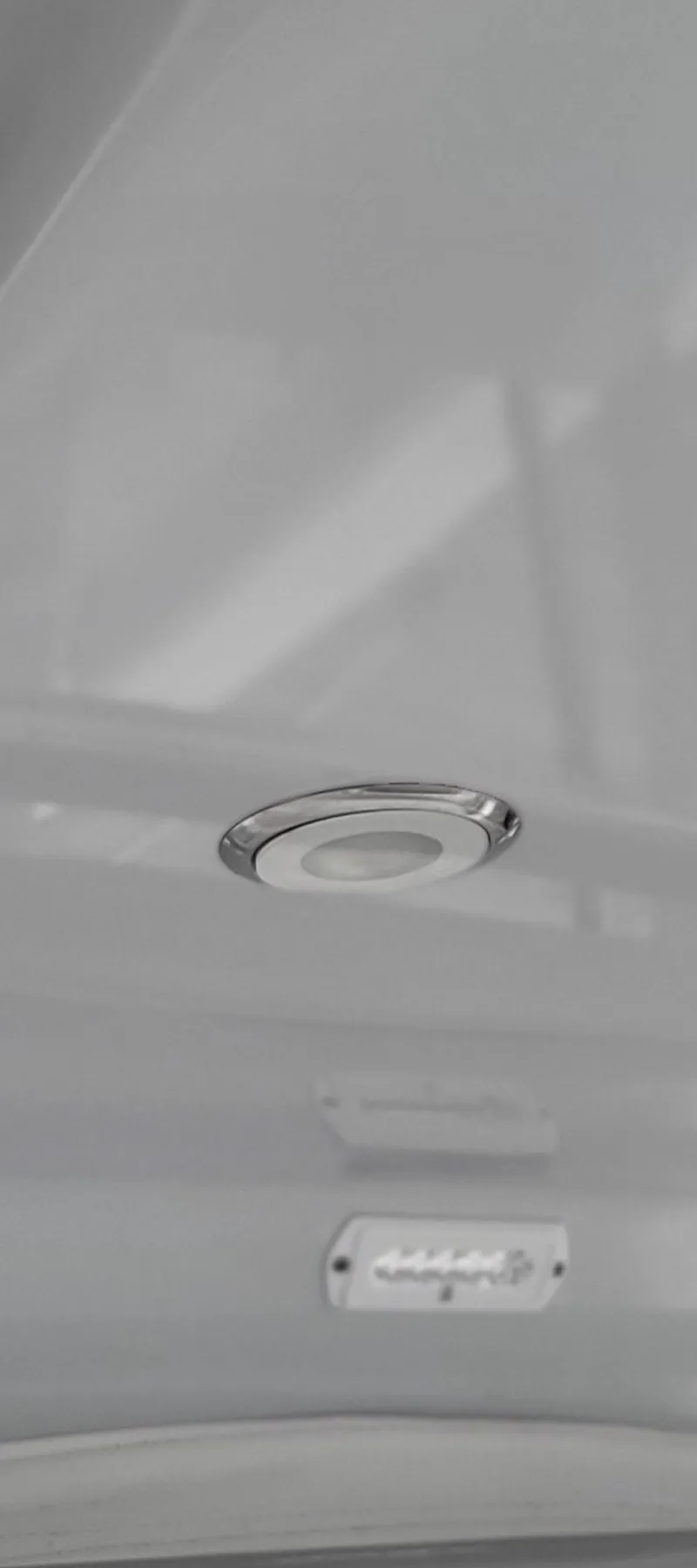Slide: The Image of 2023 Mag Bay 33 CC boat interior ceiling light detail. - 26
