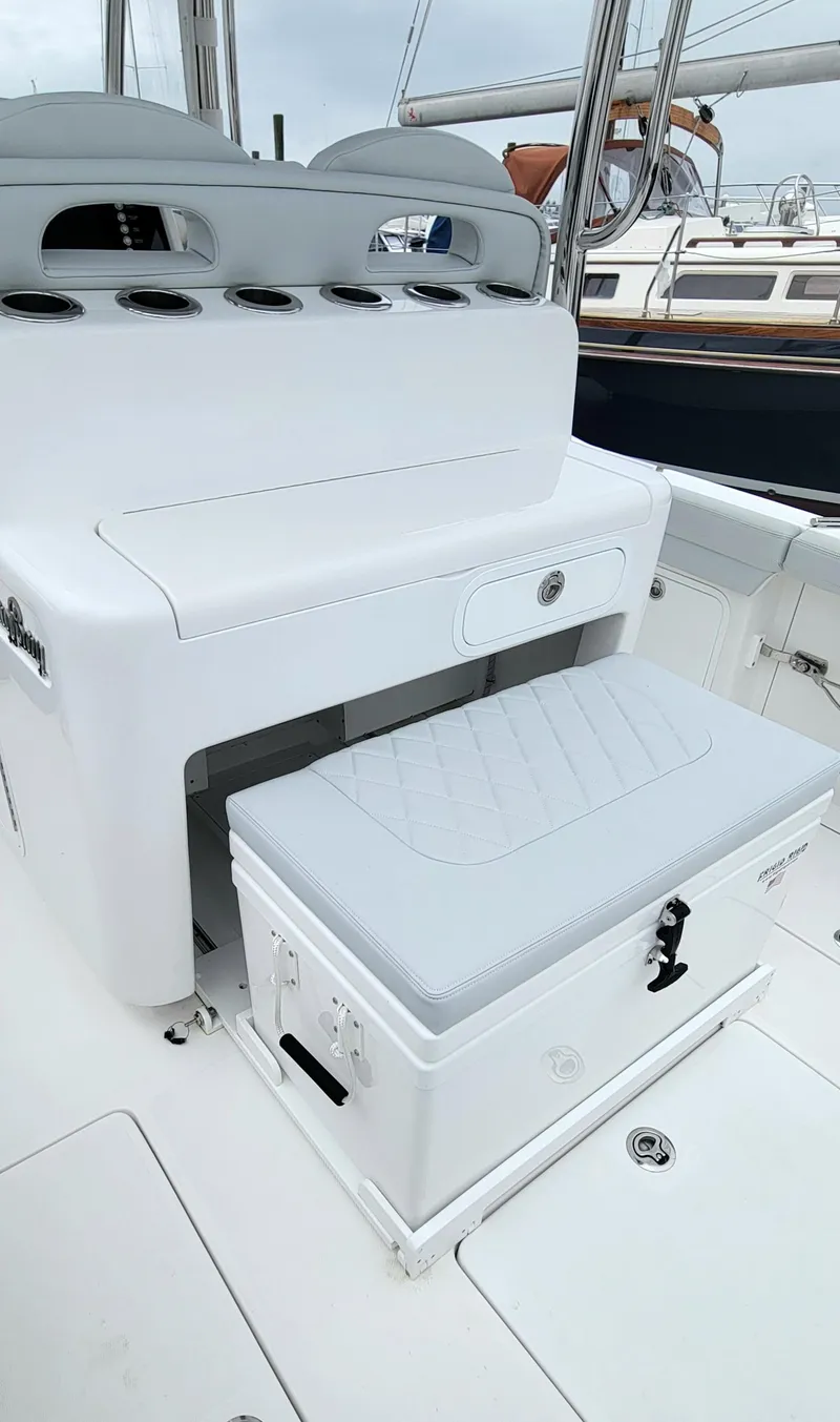 Slide: The Image of 2023 Mag Bay 33 CC boat interior with seating and storage. - 28