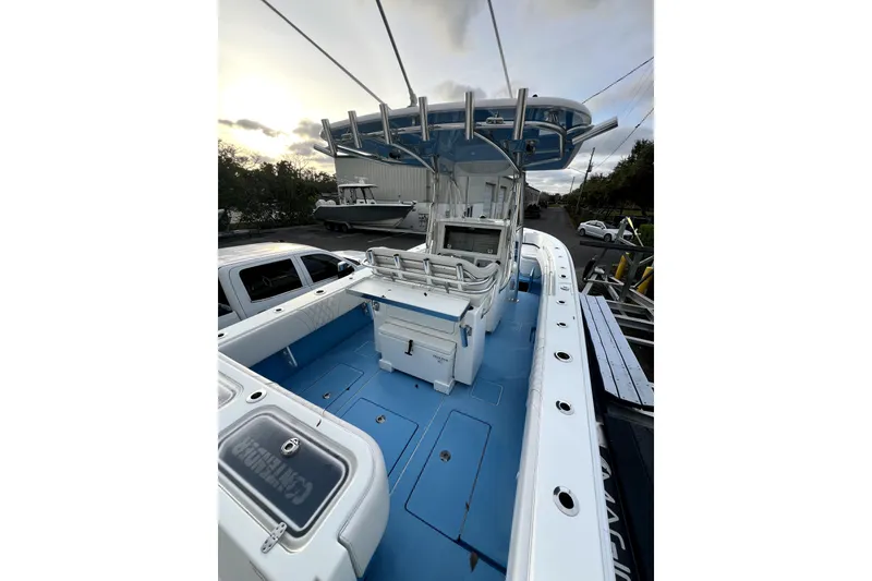Slide: The Image of 2023 Contender 30 ST boat with blue deck and advanced helm station. - 3
