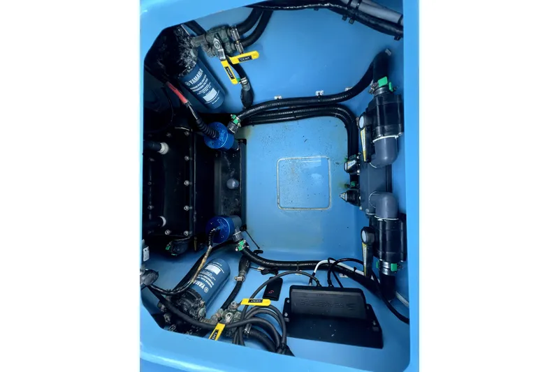 Slide: The Image of 2023 Contender 30 ST boat engine compartment with Yamaha filters and wiring. - 35
