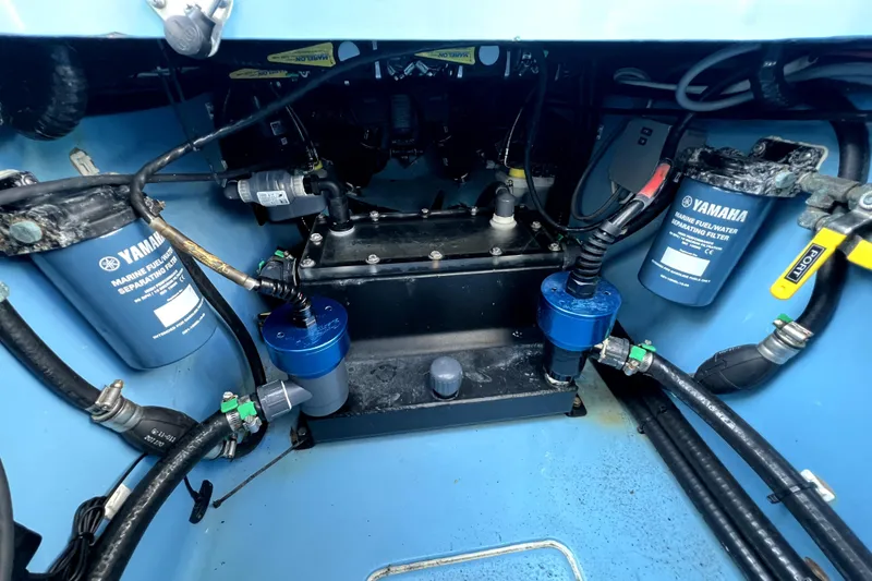 Slide: The Image of Engine compartment of 2023 Contender 30 ST boat with Yamaha marine filters and hoses. - 36