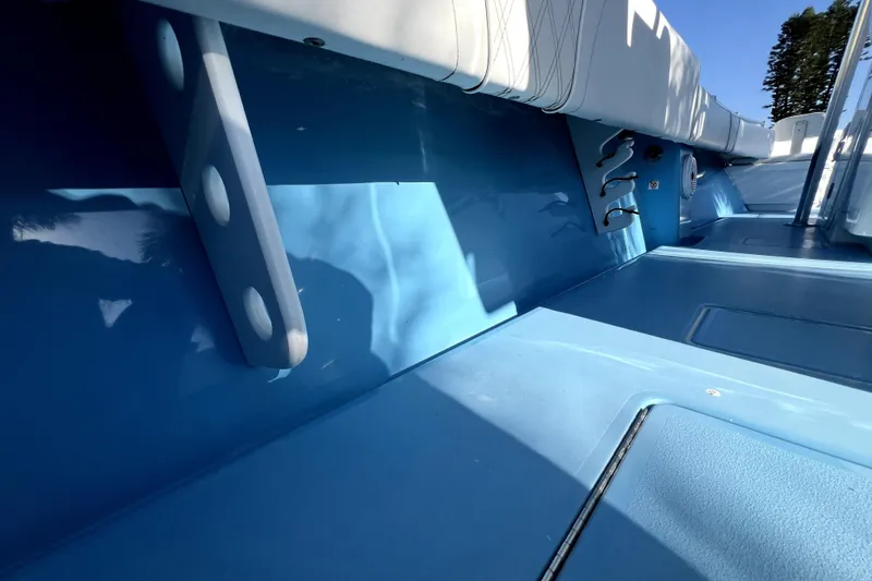Slide: The Image of Interior view of 2023 Contender 30 ST boat, featuring blue deck and seating. - 38