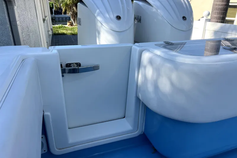Slide: The Image of 2023 Contender 30 ST boat with Yamaha engines, featuring sleek white and blue design. - 40