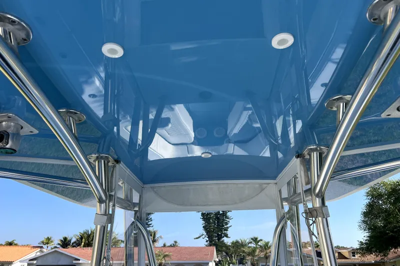 Slide: The Image of 2023 Contender 30 ST boat with blue T-top and stainless steel supports. - 41