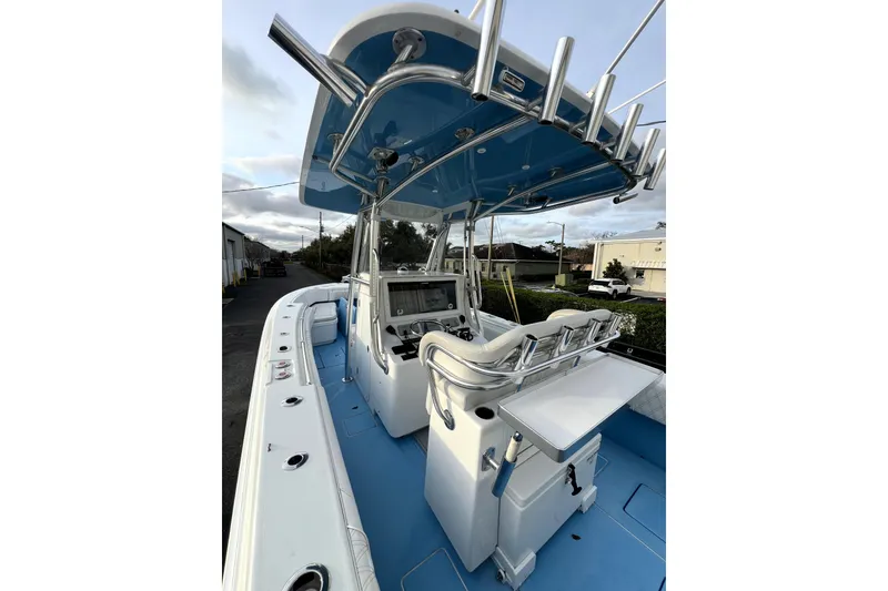 Slide: The Image of 2023 Contender 30 ST boat interior with blue deck and modern console. - 6