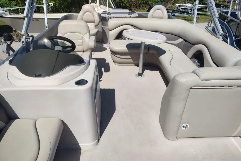 Slide: The Image of 2016 Sylvan Mirage Fish 8522 Party Fish 4.0 pontoon boat interior with plush seating. - 6